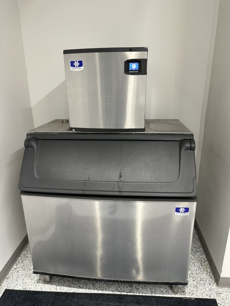 Manitowoc Indigo NXT commercial ice machine mounted on an ice storage bin