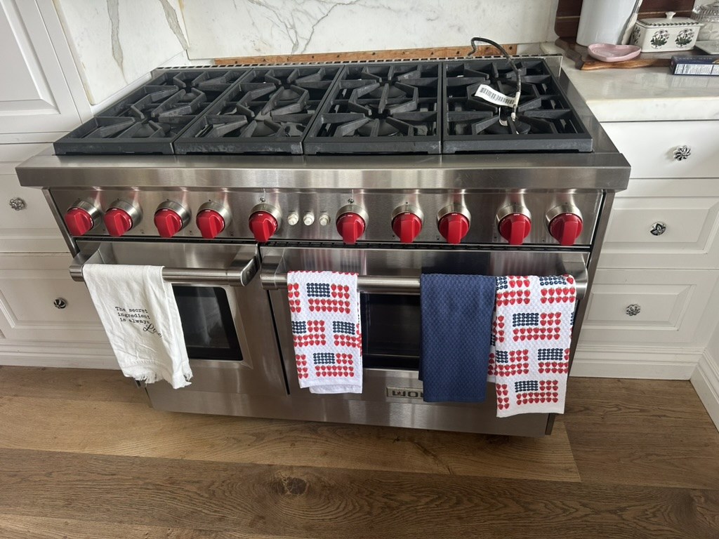 Wolf 48-inch pro-style gas range with red knobs, front view