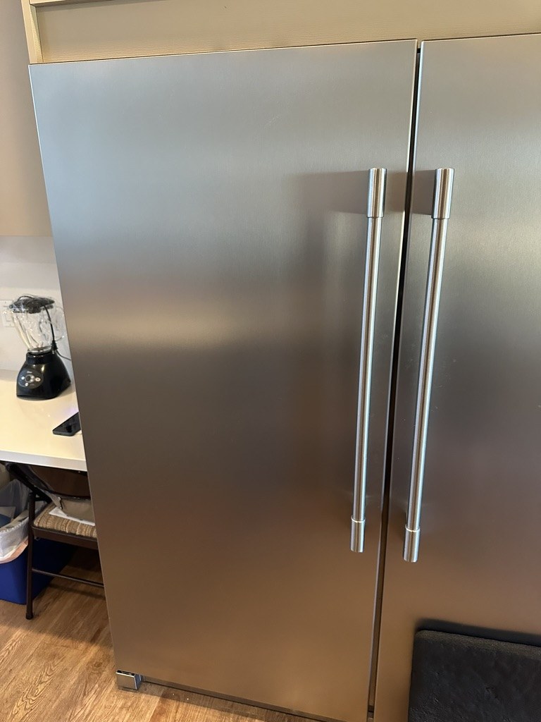 Frigidaire refrigerator and freezer installed side by side, front view