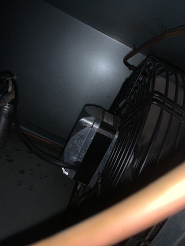 Condenser fan motor inside a Avantco commercial refrigerator during repair