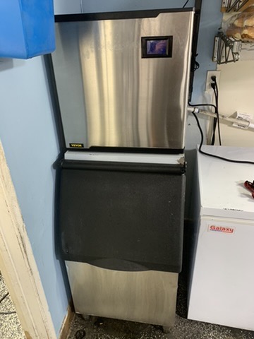 Commercial ice machine with bin, front view